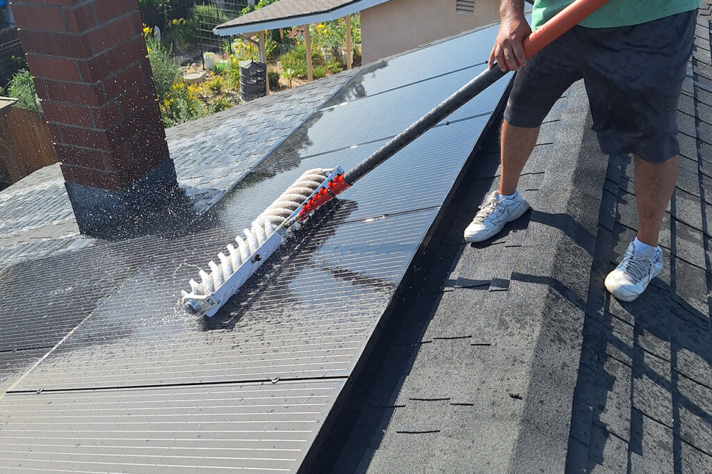 Hanford Solar Panel Cleaning - On the roof cleaning solar panels